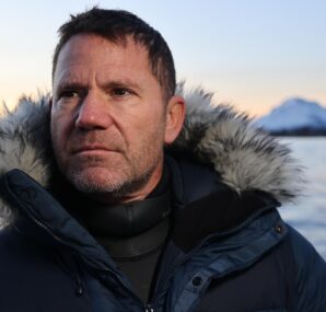 Steve Backshall holding a baby Alligator