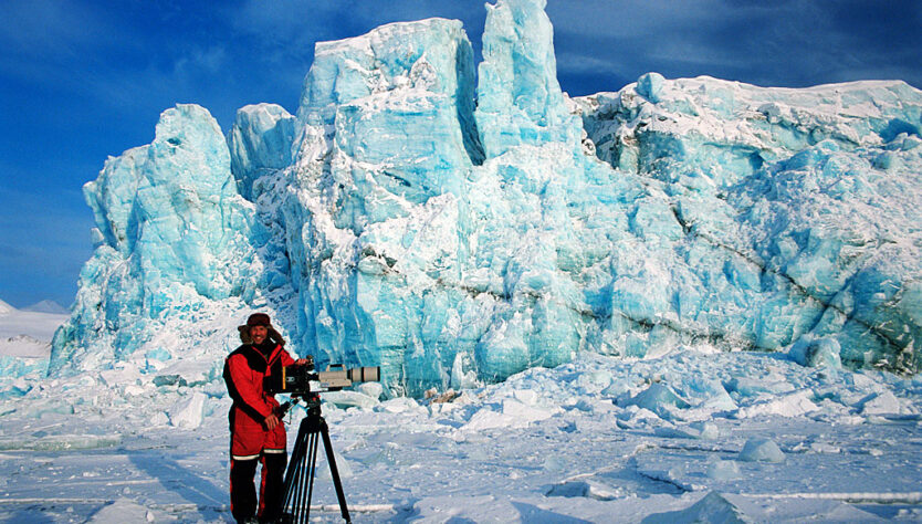 Doug Allan filming at glacier